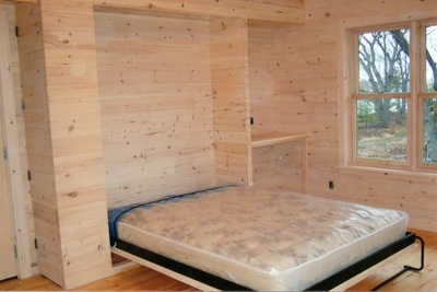 Custom murphy bed in a bunk house in the open position